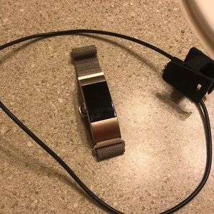 Fitbit Charge 2 with charger.